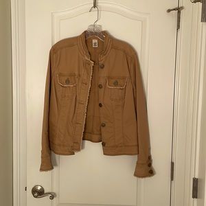 Tan cotton jacket, fringed collar, cuffs and pocket.